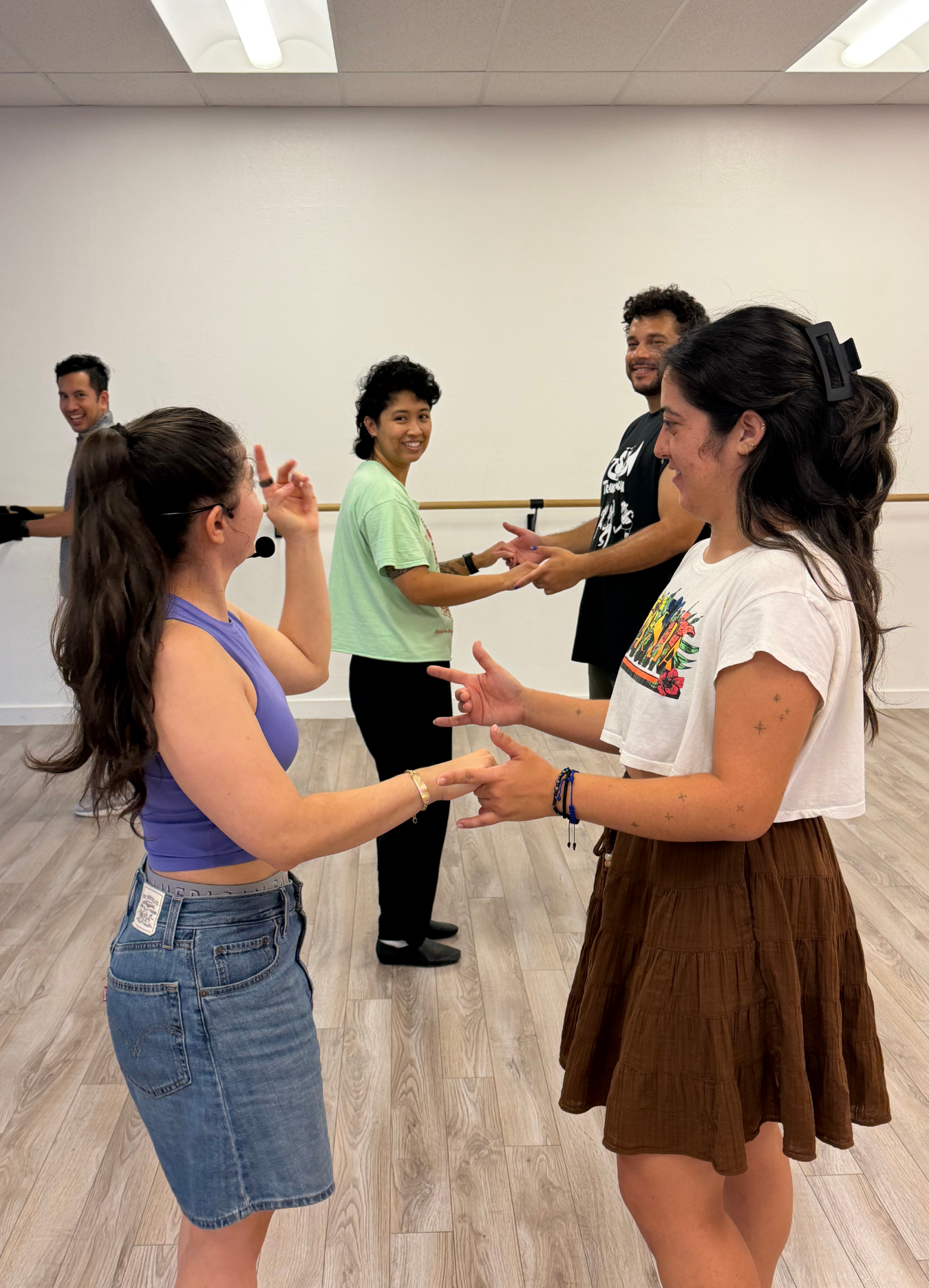Couple dancing salsa together at Sun Dance Day Fest, smiling and having fun